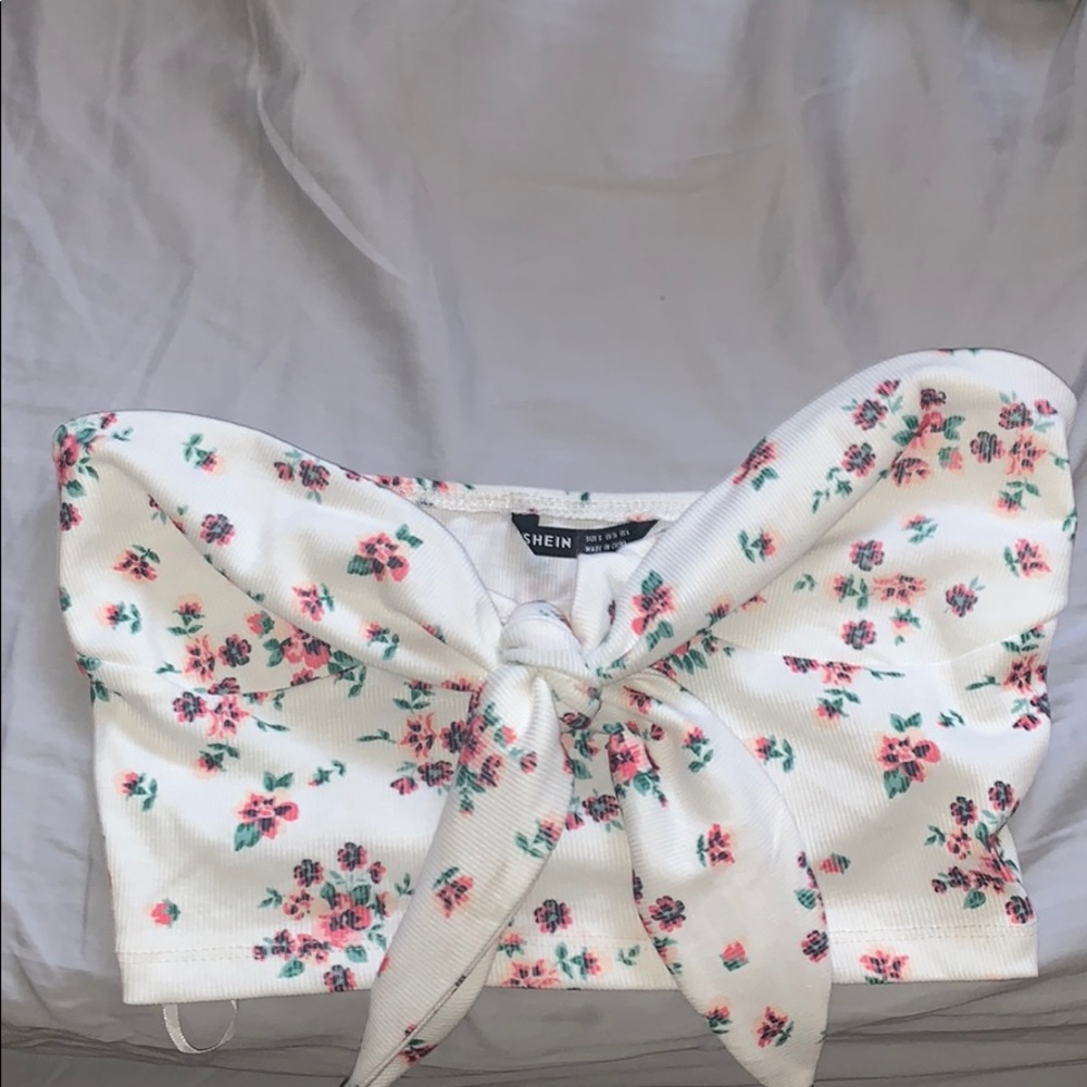 white crop top with flowers on it